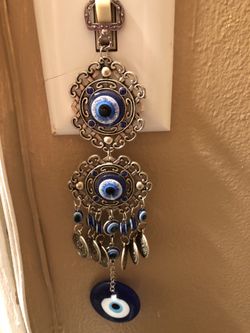 Men’s or women’s silver plated evil eye mobile hanger no refunds