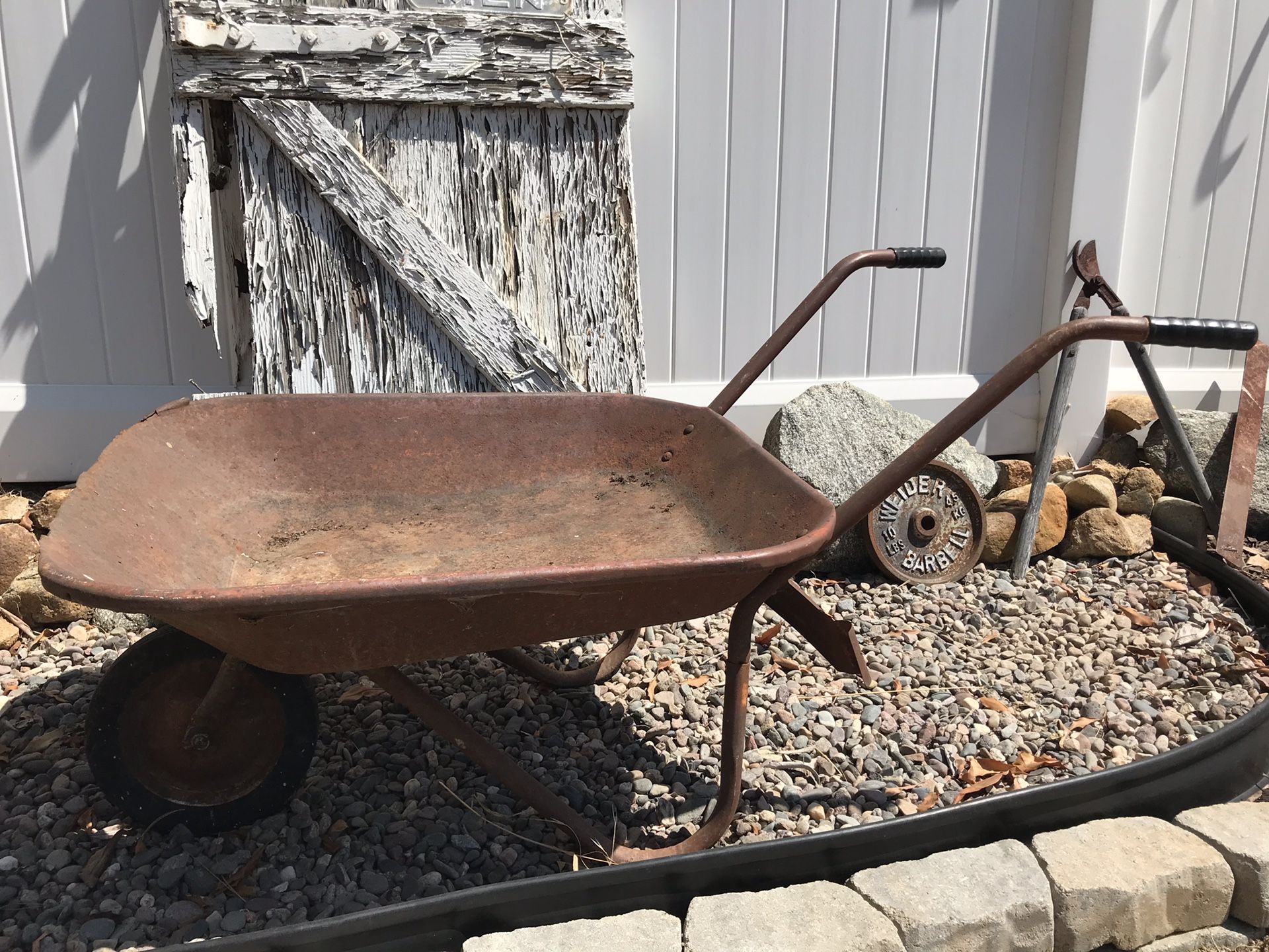 Old rusty wheelbarrow deals