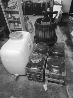 Wine press barrel and 5 gallon jugs