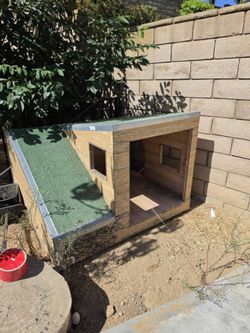 Free Large wooden dog house with a ramp-turf top platform