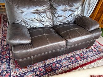 Dark Brown Leather Couch 64” long x 42 deep.
