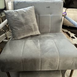 Grey chair with foot stool