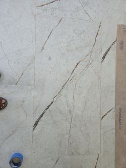 Large format 24x48 or 2'x4' tile. Glossy marble pattern. Beautiful tile