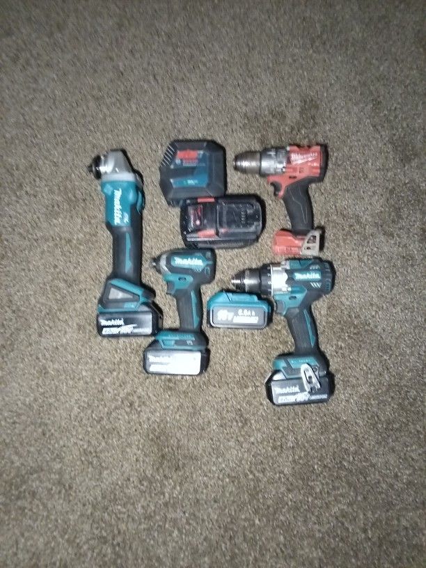 Power Tools. Makita Grinder And Makita Impact Drill And hammer Drill. Milwaukee Hammer Drill and A Bosch Laser Level
