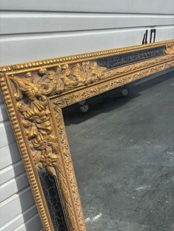Large Black & Gold  wooden frame beveled mirror . 59 “ x 46 “ $300