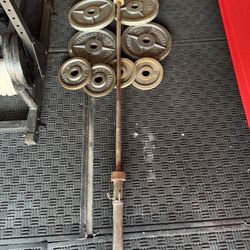 Olympic weights 180lbs total plus 7ft 45lbs bar