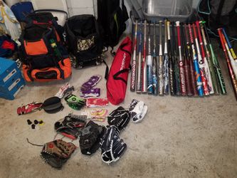 Softball bats bags gloves cleats