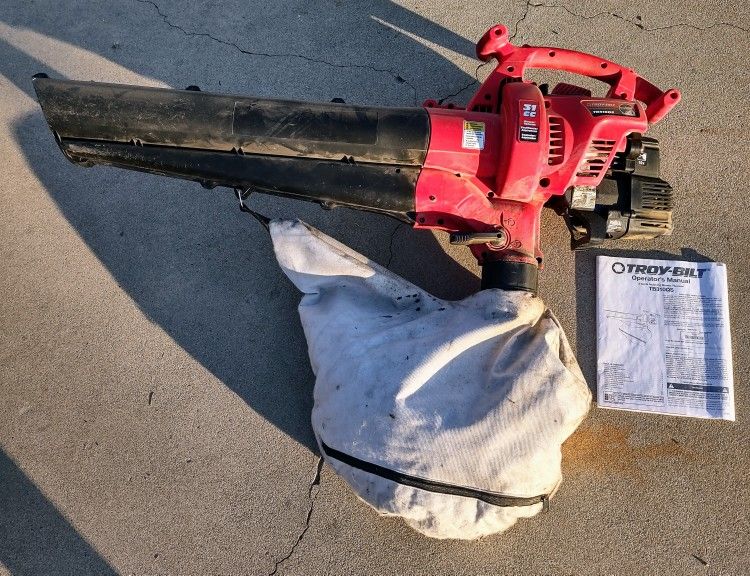 Troy-Bilt TB310QS 31cc 2-Cycle MulchiNAtor Hand Held Blower/Vacuum -
Handheld Hand-Held