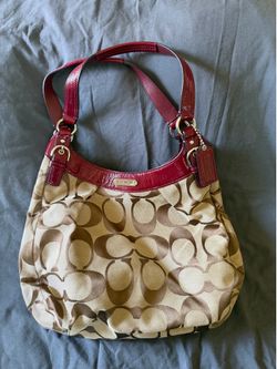 Coach brown and beige monogram canvas handbag with red accents