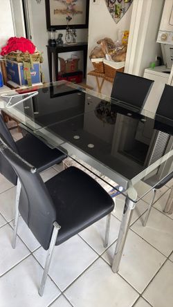 Dining room table glass, 63x35.5 and can be extended longer