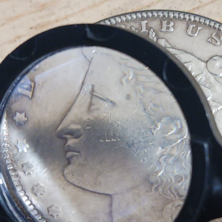 ( Need Help Intentifing  The Coin )1900  Morgan Silver Dollar