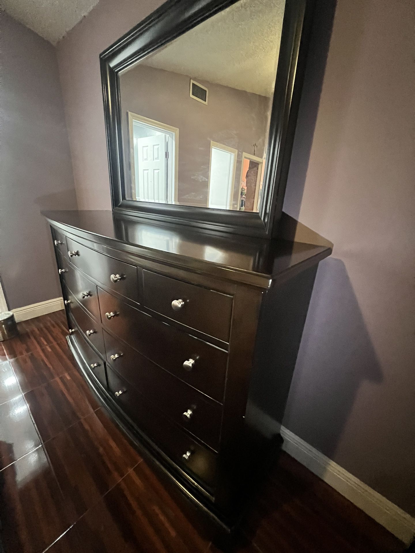 Bedroom Dresser With an Attached Mirror