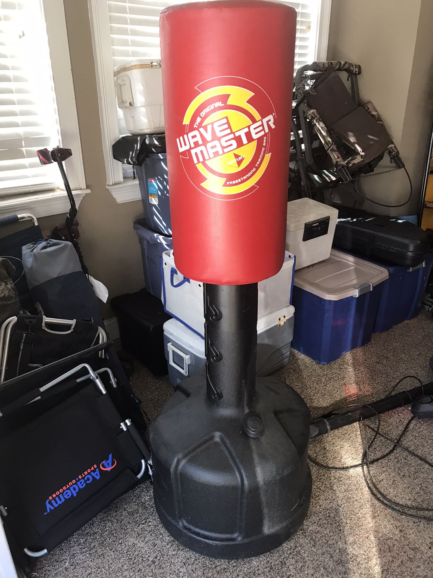 Punching bag with water-filled base