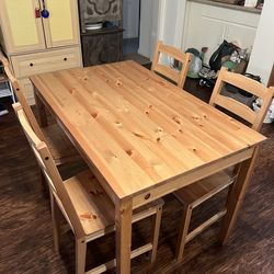 Wooden dining table and 4 chairs.