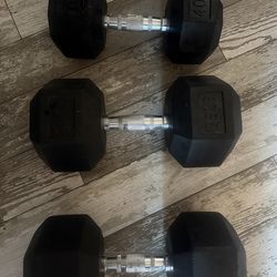Hex rubber dumbbells two 66 lb one 30 lb
