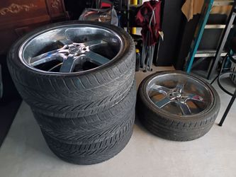 Staggered rims and tires for Chevy.5x5.  22x9.5s frt.24x9.5backs 650 or best offer