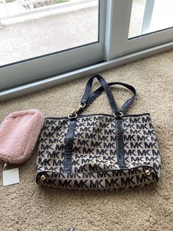 Michael Kors purse and pink travel makeup bag