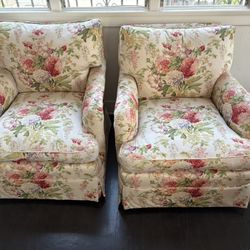 Two vintage floral swivel chairs 