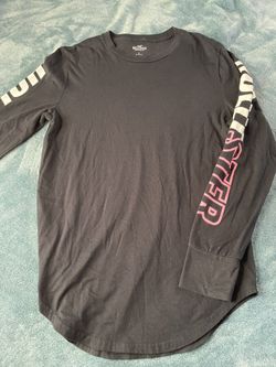 black hollister long sleeve shirt w/ pink  and white designs
