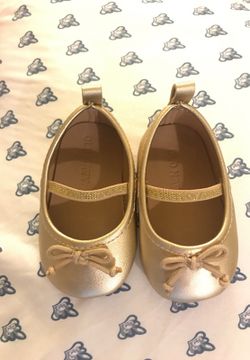 Gold baby shoes