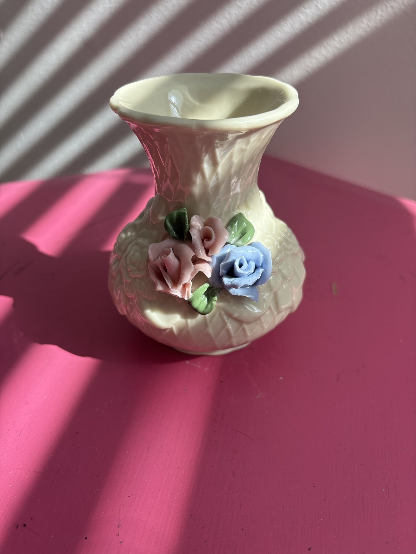 vintage porcelain bud vase,, featuring a raised floral design with pink and blue sculpted roses
