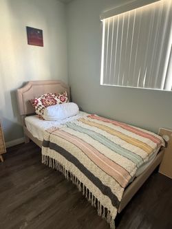 Twin bed with mattress and frame