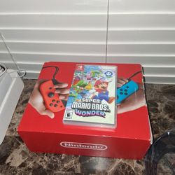 Nintendo Switch Like New & Mario Wonder $180