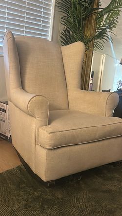 Beige Upholstered Wingback Rocking Chair