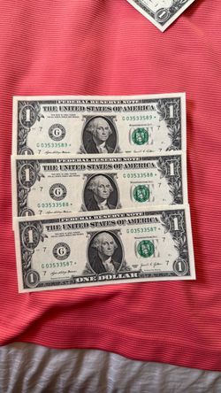 3 $1 dollar bills in sequence with a star