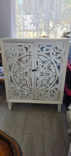 Wood boho cabinet with mirrored doors