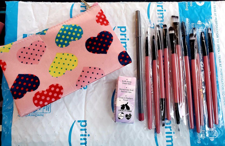 Makeup brushes, bag, lip pencil, lip moisturizer. NEW