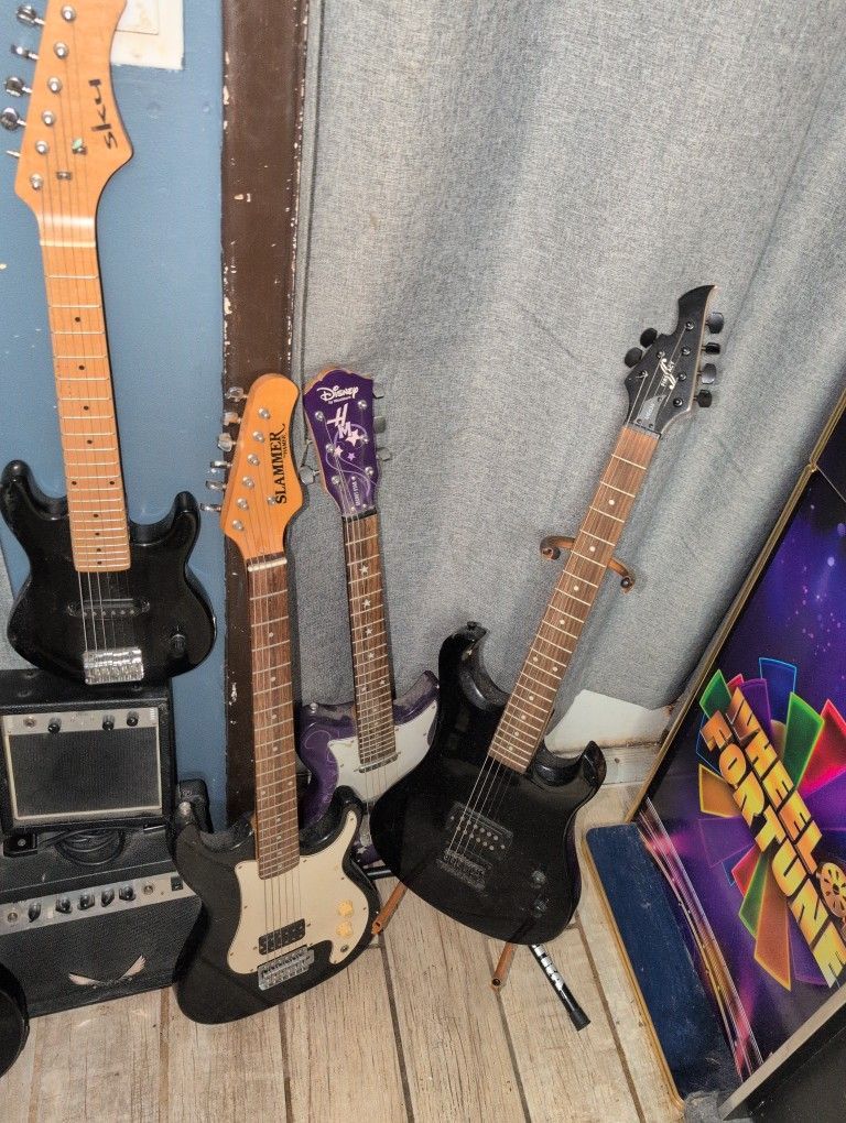 Electric And Acoustic Guitars and 2 Small Practice Amps