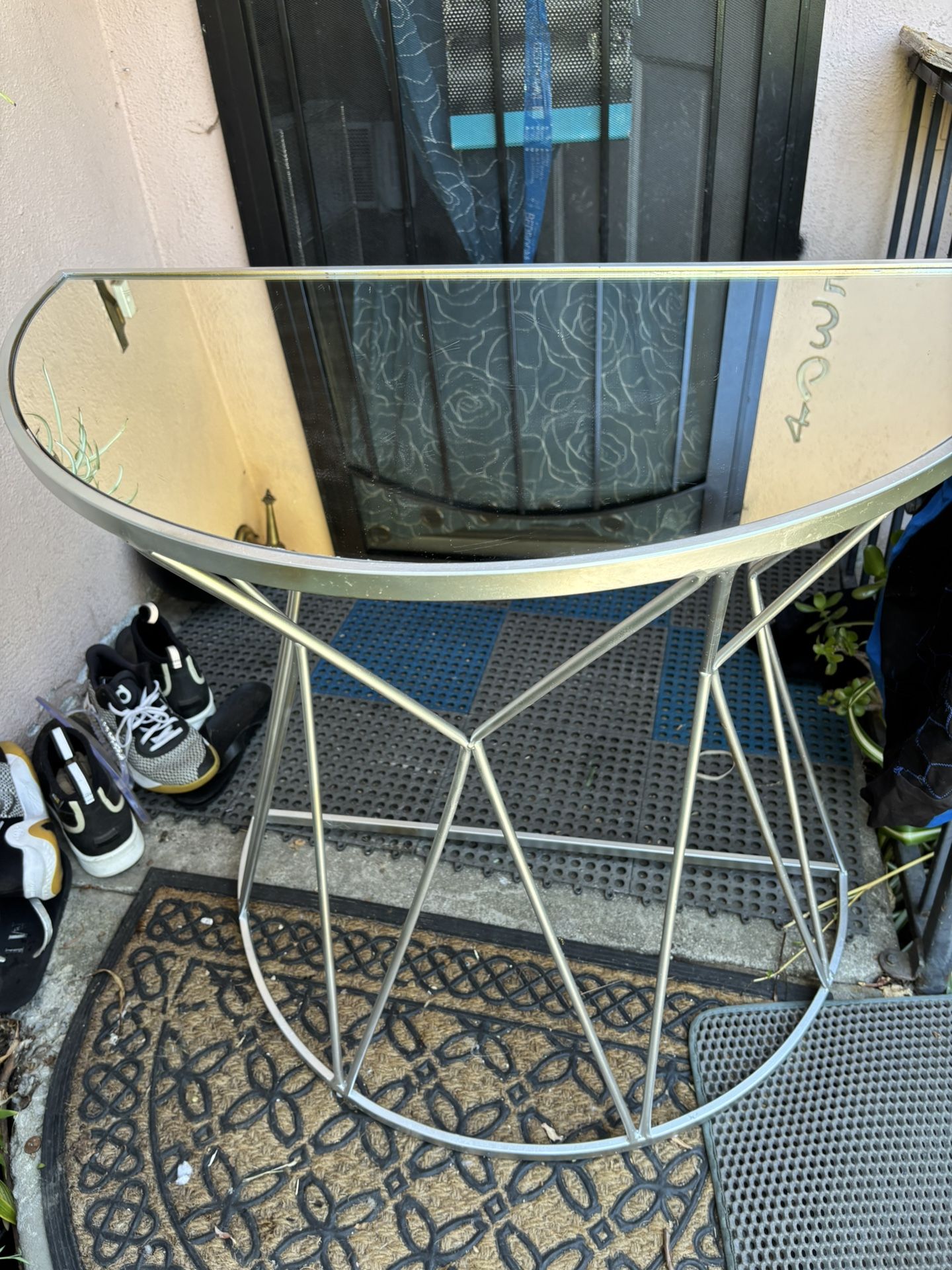 mirrored side table.Hemispere form, base silver color metal.