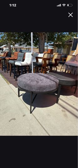 Gray fabric round ottoman