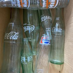 Antique Coke And Pepsi Bottles