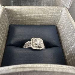 One lady's 14 karat white gold engagement ring with matching 14 karat white gold wedding band