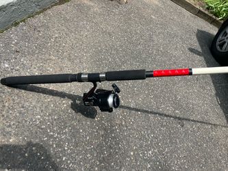 Saltwater Graphite Spinning Rod and Reel Combo ready to use.