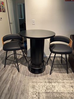 Black Counter top table and 2 swivel chairs