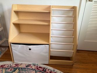 Baby nursery toy and book stand