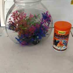 Fish Tank And Food With Decir