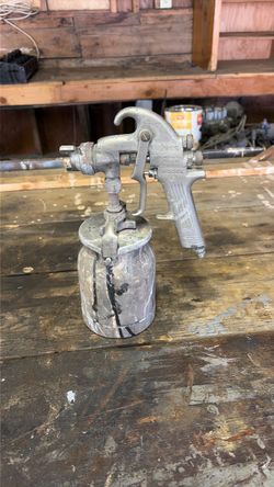 Binks Model 19 conventional air-operated paint spray gun with a metal cup