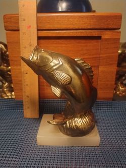 Brass bass mounted on a marble base