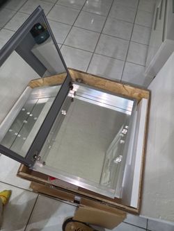 Bathroom sink,cabinet, medicine  cabinet and faucet