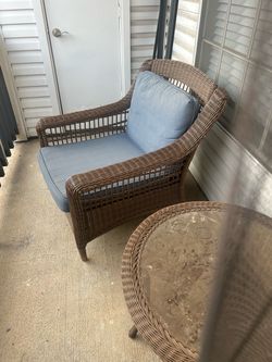 Outdoor Wicker Lounge Chair with Blue Cushions and table