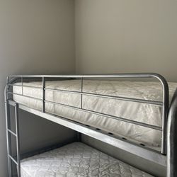 Bunk bed with ladder and safety rail