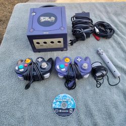 3 Controllers, 1 Mic Controller. 1 Game Mario Kart 7 . All cables, 1 Console GameCube & Power Racing Wheel Brand New In Box Tho $275 all combo