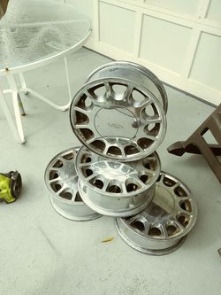 4 Ford Taurus rims 15 inch will fit others