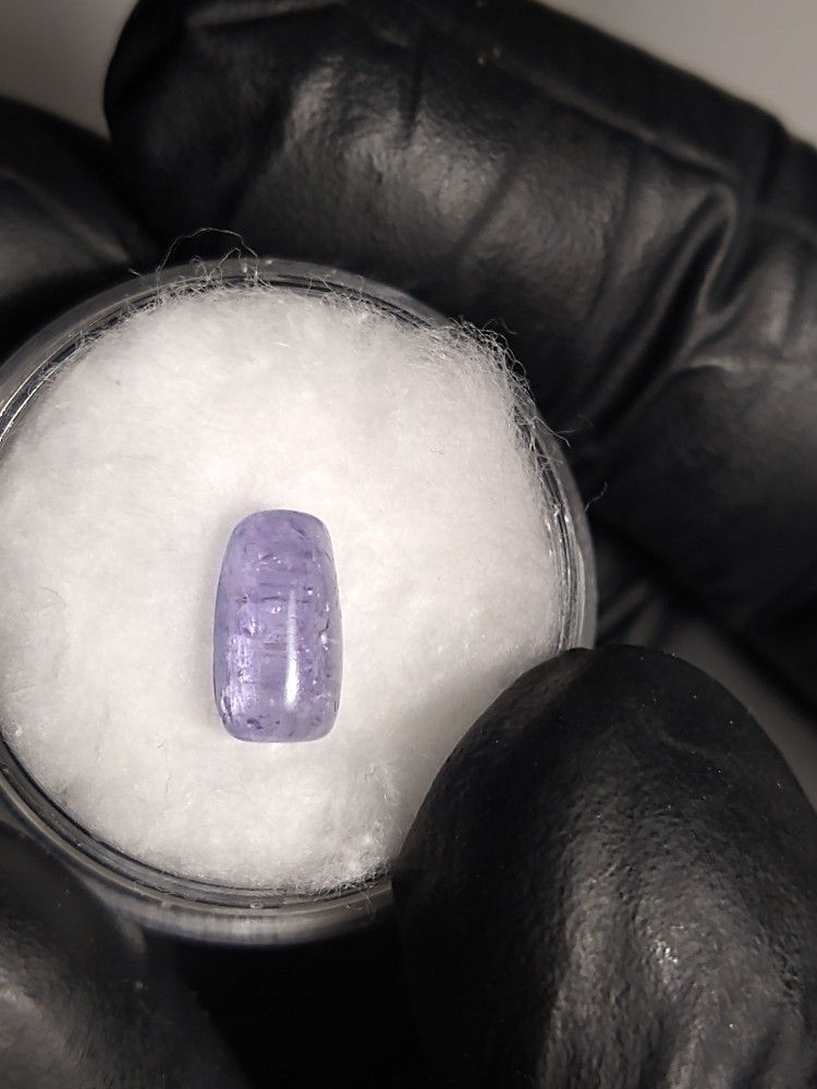 Natural Tanzanite Cabochon Gemstone in Display