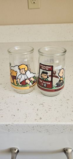 Two Vintage Peanuts jam jars