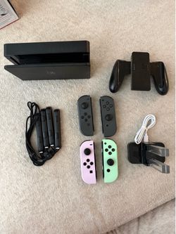 Nintendo Switch OLED with extra controllers and games